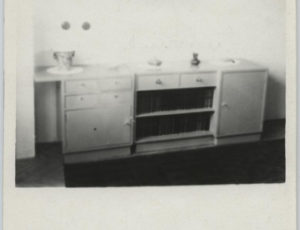 A chest, a library and a landscape painting on a wall in an apartment confiscated by the Treuhandstelle (source: http://collections.jewishmuseum.cz)